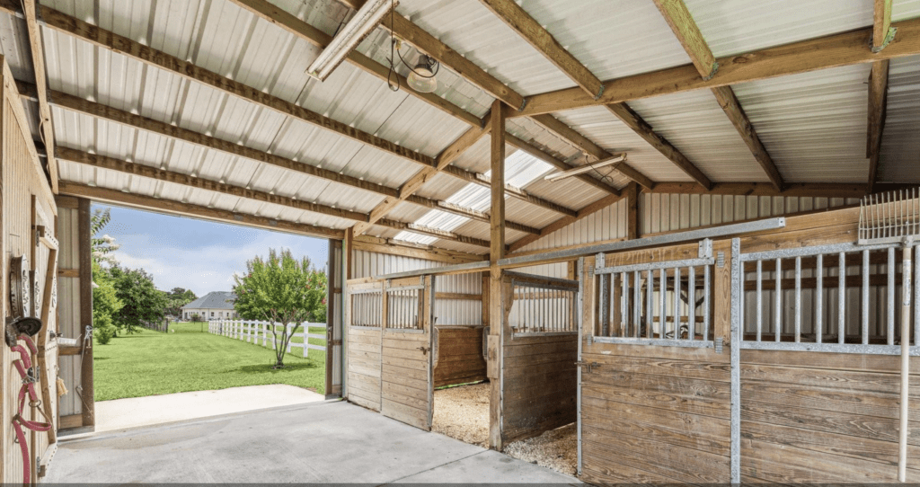 A spread of almost four acres at 2403 San Miguel in Friendswood is large enough for a double stall horse barn and room for riding. (Photo by TK Images for Compass)